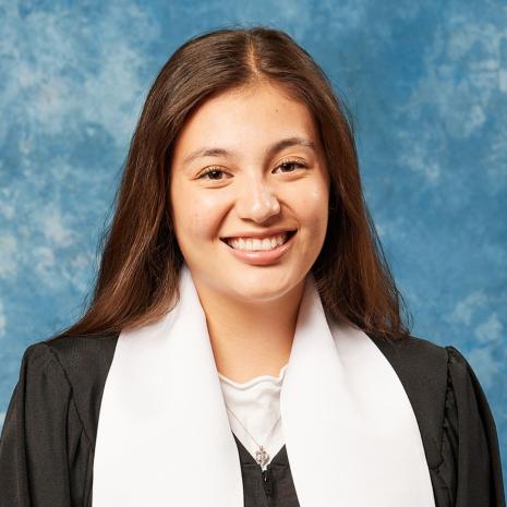 student with graduation gown