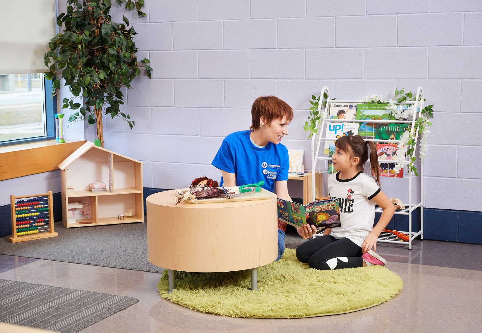 ece student reads book to child